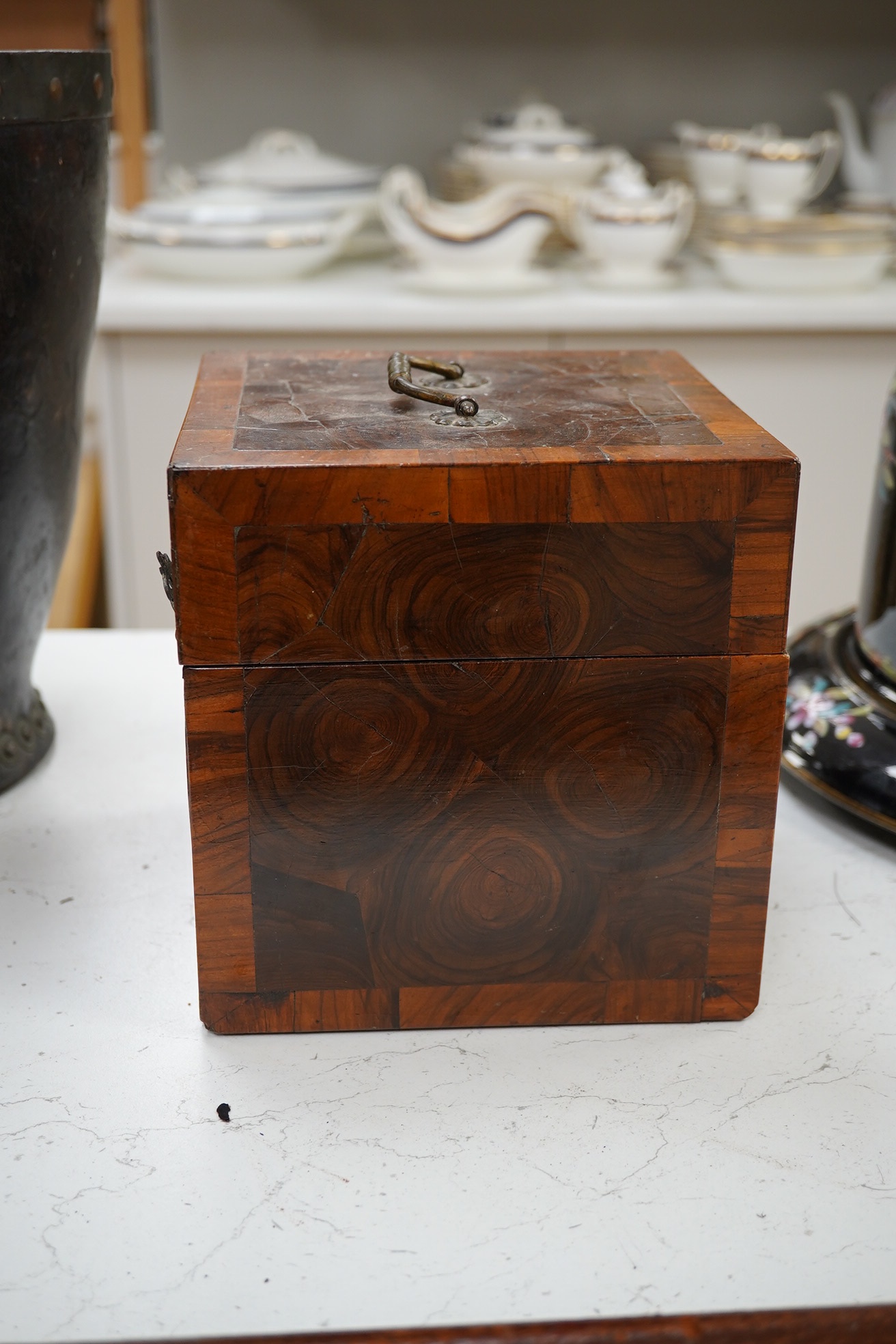 An 18th century German kingwood and olive wood veneered casket, containing a large quantity of buttons, 17 x 16.5 x 16.5cm. Condition - poor